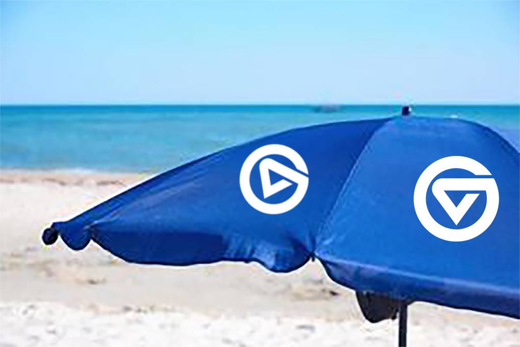 Beach umbrella with GVSU logos.